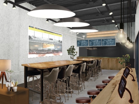 壁面には「アンテナ」のページを常時投影しカウンターにはiPadを用意する店内イメージ