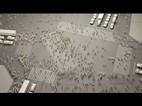 約1000体の人型キャラクター「原器くん」がスクランブル交差点を渡る