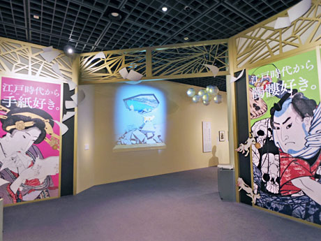 会場入り口ではプロジェクションマッピングの技術を生かした演出も行っている