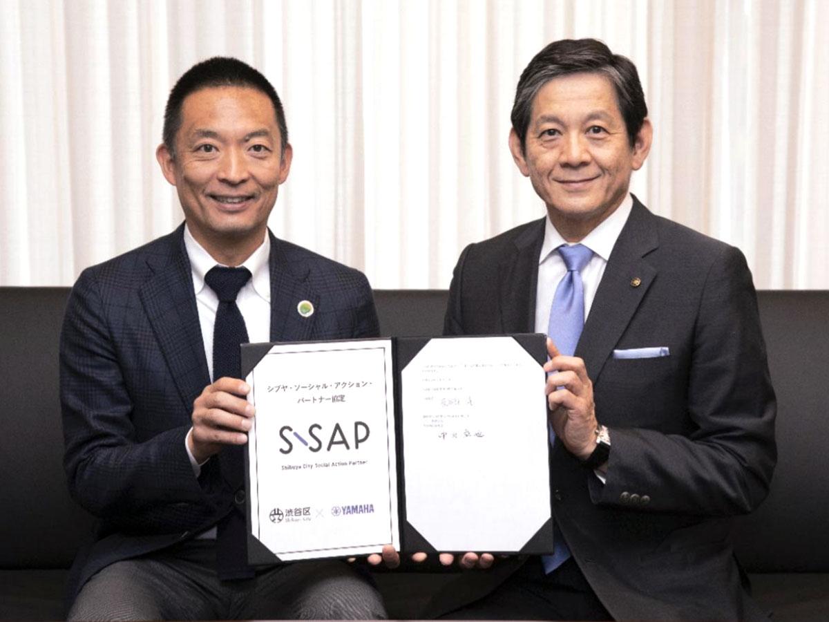 （左から）長谷部健渋谷区長とヤマハ中田卓也社長